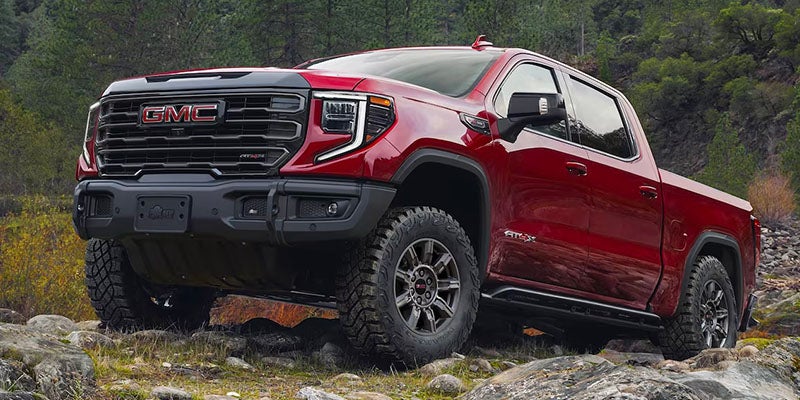 A red Sierra 1500 climbing on hills and stones