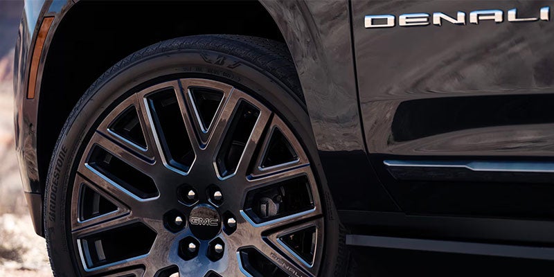 A Yukon GMC Tire with Denali Logo
