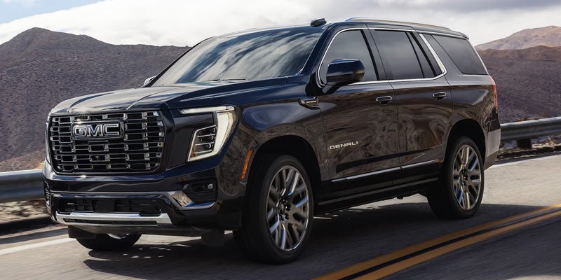 2026 GMC Yukon XL Denali Ultimate driving on highway