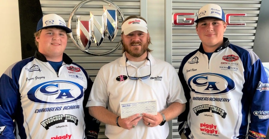 three customers holding check